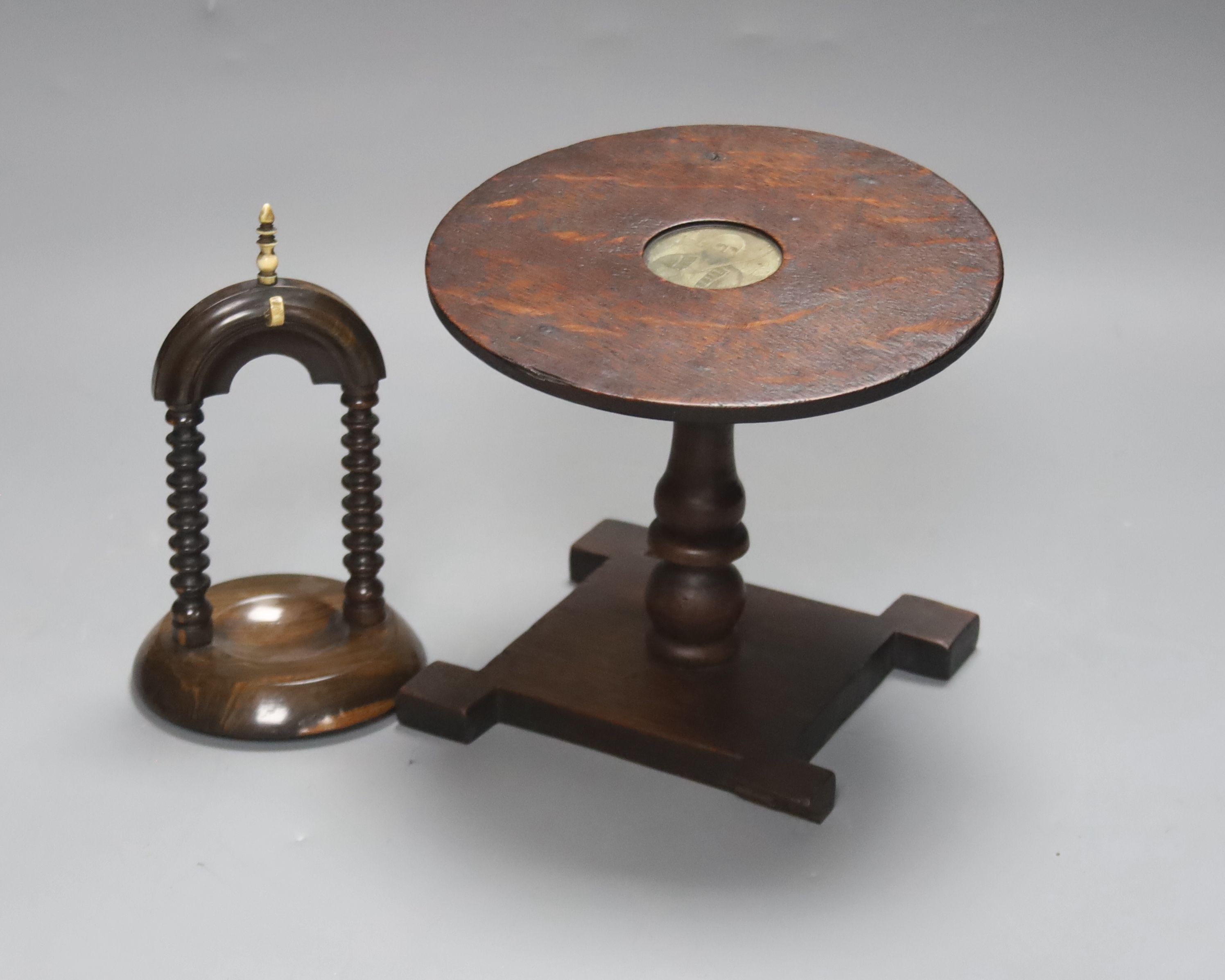A 19th century oak miniature tilt top table with naval portrait, 23.5cm high tilted up, and a lignum vitae watchstand